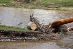 A wine barrel is seen on the bank of Ahr river following heavy rainfalls, Germany, July 18, 2021.