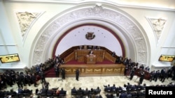 FILE - Venezuela's President Nicolas Maduro (C) addresses lawmakers at the National Assembly during his annual report of the state of the nation at the National Assembly in Caracas, Jan. 15, 2016.