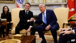 President Donald Trump, right, meets with France's President Emmanuel Macron in the Oval Office of the White House in Washington, Feb. 24, 2025.