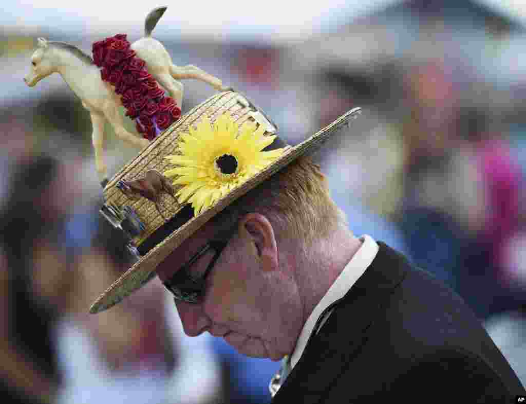 Mike Seiter walks in the grandstand before the 139th Preakness Stakes horse race at Pimlico Race Course, Maryland, May 17, 2014.
