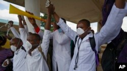 FILE - Kenyan nurses and other health-workers demonstrate over low pay at Uhuru Park in downtown Nairobi, Kenya Thursday, Dec. 8, 2016. 