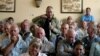 FILE - A farmer addresses a meeting of white commercial farmers in Harare, Zimbabwe, Feb. 5, 2010.