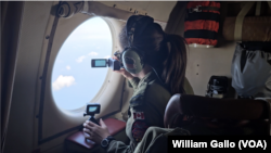 Crew aboard a Canadian CP-140 military surveillance plane monitor activity in the East China Sea, Oct. 14, 2024. 