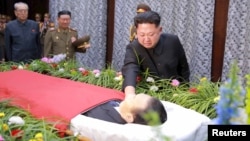 North Korean leader Kim Jong Un pays his last respects to Kim Yang Gon in this undated photo released by North Korea's Korean Central News Agency (KCNA) in Pyongyang on Dec. 31, 2015.