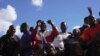 Prisoners celebrate after being released from Chikurubi Maximum prison on the outskirts of the capital Harare, Thursday, April 18, 2024. 