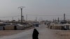 A female prisoner in al-Hol Camp, the largest prison camp in northeastern Syria, on Oct. 12, 2024. (Diego Baravelli/VOA) 