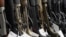 FILE - Hunting rifles are displayed for sale at Firearms Unknown, a gun store in Oceanside, California, April 12, 2021.