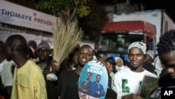 FILE—Supporters of presidential candidate Bassirou Diomaye Faye and Senegal's top opposition leader, Ousmane Sonko, gather outside their campaign headquarters as they await the results of the presidential election, in Dakar, Senegal, March 24, 2024.