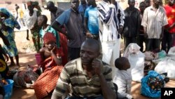 FILE - Villagers who fled the village of Gwoza, after an attack by Boko Haram in November, arrive at a camp for internally displaced people in Yola, Nigeria.