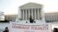 Supporters of gay marriage hold a banner as they rally in front of the Supreme Court in Washington March 27, 2013. 