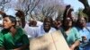 Zimbabwean medical staff march on the streets of Harare, Sept. 19, 2019.