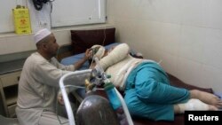 A wounded Turkish engineer receives treatment at a hospital after a suicide bomb attack in Jalalabad city, June 2, 2014.