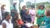 Mothers at Marondera Hospital talk to U.S. officials about HIV and AIDS on Dec. 10, 2024, in Marondera, Zimbabwe.