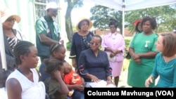 Mothers at Marondera Hospital talk to U.S. officials about HIV and AIDS on Dec. 10, 2024, in Marondera, Zimbabwe.