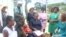 Mothers at Marondera Hospital talk to U.S. officials about HIV and AIDS on Dec. 10, 2024, in Marondera, Zimbabwe.