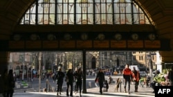 People enter Flinders Street Station in Melbourne on Aug. 5, 2024. Australia raised its terrorism threat level on Aug. 5 to "probable," with the country's top intelligence official citing a homegrown rise in "extreme ideologies." 