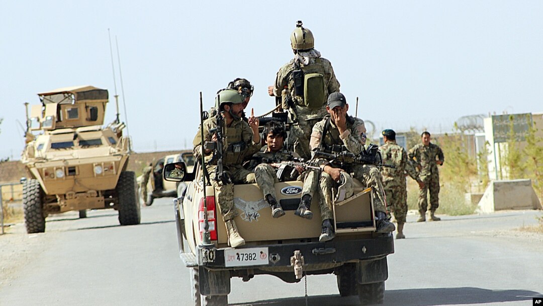 Afghan National Army soldiers arrive to start an operation, outside of Kunduz city, north of Kabul, Afghanistan, Sept. 30, 2015.