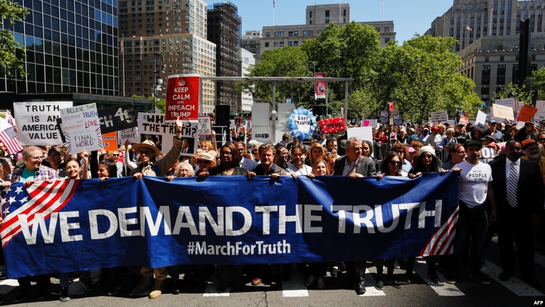 Demonstrators march as they take part in an anti-Trump "March for Truth" rally on June 3, 2017 in New York City.