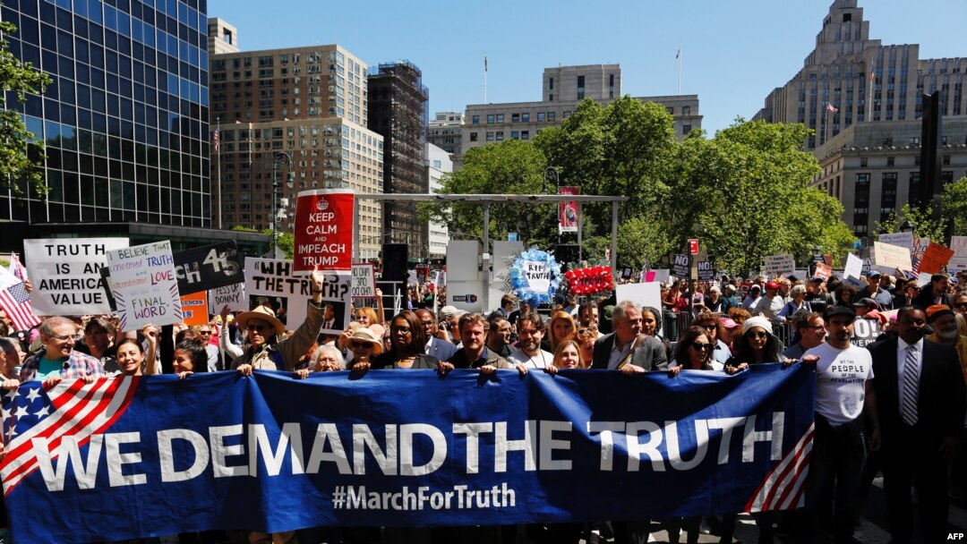 Demonstrators march as they take part in an anti-Trump "March for Truth" rally on June 3, 2017 in New York City.