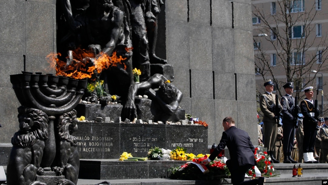 Polish President Andrzej Duda lays a wreath during state ceremonies in homage to the victims and fighters of the 1943 Warsaw Ghetto Uprising, on the 75th anniversary of the start of the revolt, in front of the Monument to the Warsaw Ghetto Heroes, in Wars