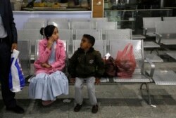 A Yemeni girl and boy wait in the departure lounge at Sanaa International airport, in Yemen, Feb. 3, 2020. A United Nations medical relief flight carrying patients from Yemen's rebel-held capital took off Monday, the first such aid flight in years.