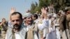 Yemeni prisoners gesture after being released by the Saudi-led coalition, during their arrival at the airport in Sanaa, Yemen, Oct. 15, 2020. 