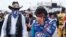 Driver Bubba Wallace, right, is overcome with emotion as he and team owner Richard Petty walk to his car prior to the start of the NASCAR Cup Series auto race at the Talladega Superspeedway in Talladega Ala., June 22, 2020. 