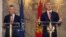 FILE - Montenegro's Prime Minister Milo Djukanovic, right, speaks and gestures after talks with NATO Secretary-General Jens Stoltenberg, in Podgorica, Montenegro.
