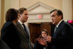 From left, Stanford professor Pamela Karlan, Harvard professor Noah Feldman and George Washington professor Jonathan Turley talk during a break in a House hearing on grounds for impeaching President Donald Trump, in Washington, Dec. 4, 2019.