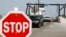 FILE - People arrive at Cape Hatteras ferry terminal in North Carolina, Aug. 25, 2011. The ferry is the only access to Ocracoke Island, which along with Hatteras is welcoming tourists back now that electricity has been restored.