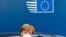 German Chancellor Angela Merkel wears a protective face mask as she arrives for the continuation of an EU summit meeting in Brussels, Belgium, July 20, 2020. 