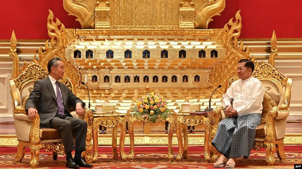 FILE - This photograph taken and released on Aug. 14, 2024, by the Myanmar Military Information Team shows Myanmar's military chief Min Aung Hlaing (R) meeting with China's Foreign Minister Wang Yi in Naypyidaw.