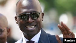 FILE - Finance Minister Malusi Gigaba arrives to deliver his budget address at Parliament in Cape Town, South Africa, Feb. 21, 2018.