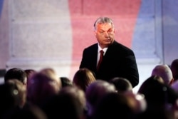 Hungarian PM Viktor Orban leaves the stage after delivering a speech at the National Museum in Prague, Czech Republic, Nov. 17, 2019, during an event marking the 30th anniversary of the pro-democratic Velvet Revolution.