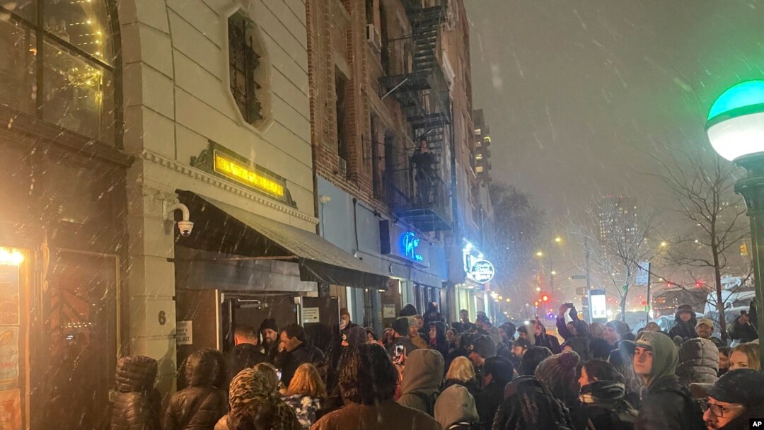 People gather outside the Bowery Ballroom where Paul McCartney’s surprise show was held in New York, Feb. 11, 2025.