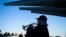 Bugler Nan LaCorte play taps during a ceremony commemorating the anniversary of the Dec. 7, 1941 Japanese attack on Pearl Harbor, on board The Battleship New Jersey Museum and Memorial in Camden, N.J., Thursday, Dec. 7, 2017.