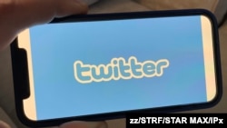 FILE - The Twitter logo photographed off an iPhone 12 pro. (STAR MAX)