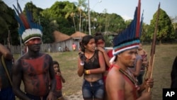 People gather for a meeting of the Tembe tribes in the Tekohaw village, in Para state, Brazil, Sept. 3, 2019.