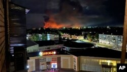 This image made from social media and and provided by Ostorozhno Novosti shows smoke billowing over the city and a large blaze in Pskov, Russia, on Aug. 29, 2023. The attack appeared to be the largest on Russian soil since Moscow sent troops into Ukraine 18 months ago.