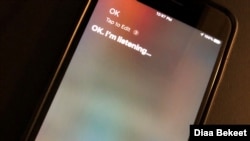 FILE - An iPhone screen displays a message from Siri, Oct. 29, 2019, in Washington. (VOA)