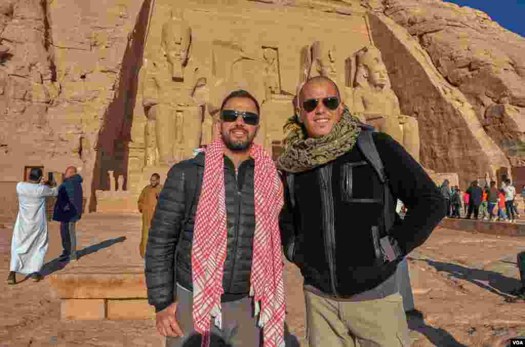 Pablo (L), a Spanish Egyptologist working in Luxor, says &quot;today is special because it is 22/02/2020 and it is the sun festival, we enjoyed the celebration from the beginning to the end.” His friend Mariano (R) came with him. (Hamada Elrasam/VOA)