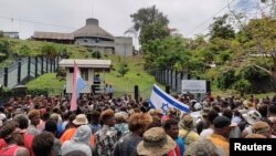 Protesters gather outside the parliament building in Honiara, Solomon Islands, Nov. 24, 2021, in this screen grab obtained by Reuters, from a social media video. (Georgina Kekea via Reuters)