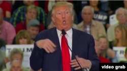 Presidential hopeful, Donald Trump, flails his arms Tuesday when speaking about a disabled New York Times reporter.