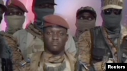 Captain Ibrahim Traore looks on during the announcement on television that he has ousted Burkina Faso's military leader Paul-Henri Damiba and dissolved the government and constitution, in Ouagadougou