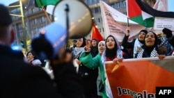 People take part in a rally in solidarity with Palestinians in Berlin, Germany, on Nov. 18, 2023. The German Foreign Ministry said it found no misuse of humanitarian aid to the Palestinian territories in a review prompted by the Oct. 7 Hamas attacks on Israel.