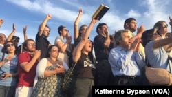 Supporters cheer as Democratic presidential candidate Bernie Sanders speaks outside R.F.K. Stadium, in southeast Washington, June 9, 2016.