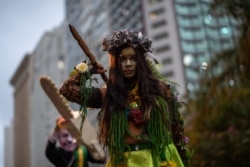 Activists take part in a demonstration against Brazilian President Jair Bolsonaro's environmental policies and the destruction of the Amazon rainforest in Rio de Janeiro, Brazil, Sept. 5, 2019.