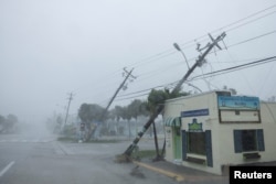 Broken utility poles downed by strong wind gusts are seen as Hurricane Milton approaches Fort Myers, Florida, U.S. October 9, 2024. (REUTERS/Ricardo Arduengo)