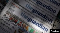 Copies of the Guardian newspaper are displayed at a newsstand in London, August 21 2013.