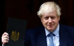 Britain's Prime Minister Boris Johnson leaves Downing Street in London, Britain, Sept. 25, 2019.